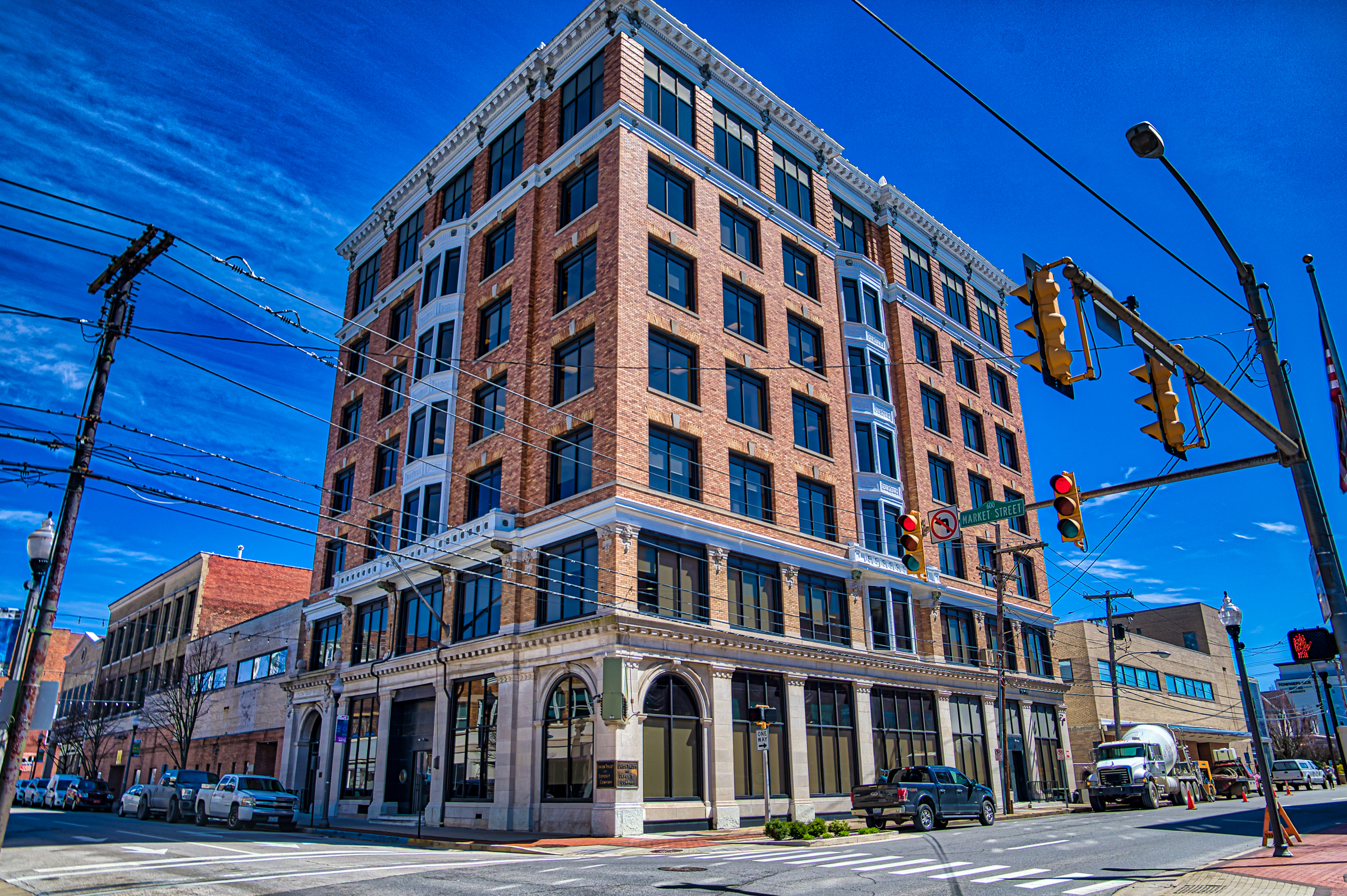 The brick and stone exterior of 700 Market Street on a downtown Parkersburg street corner.